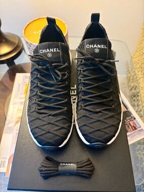 CHANEL Black Knit women’s Sneakers with White Sole and CHANEL LOGO on back